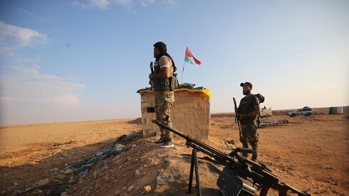 Combatientes pro-iraníes en Siria, cerca de la frontera con Irak.
