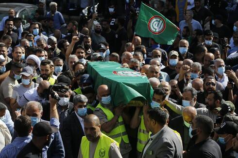 Escena del velatorio público de las víctimas libanesas. 