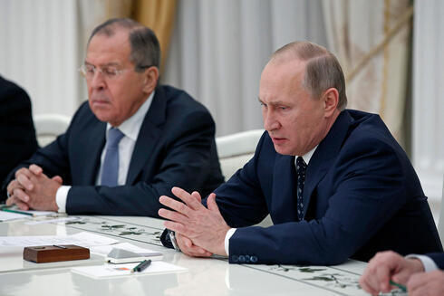 El ministro de Asuntos Exteriores ruso, Serguéi Lavrov, y el presidente ruso, Vladímir Putin.