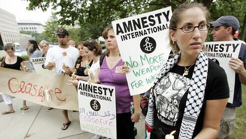 Una vigilia de Amnistía Internacional celebrada en DC en 2014 en memoria de los habitantes de Gaza muertos en la guerra con Israel. (AP ) Una vigilia de Amnistía Internacional celebrada en DC en 2014 en memoria de los habitantes de Gaza muertos en la guerra con Israel.